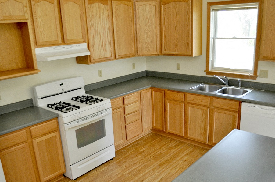 a kitchen with a stove and a sink
