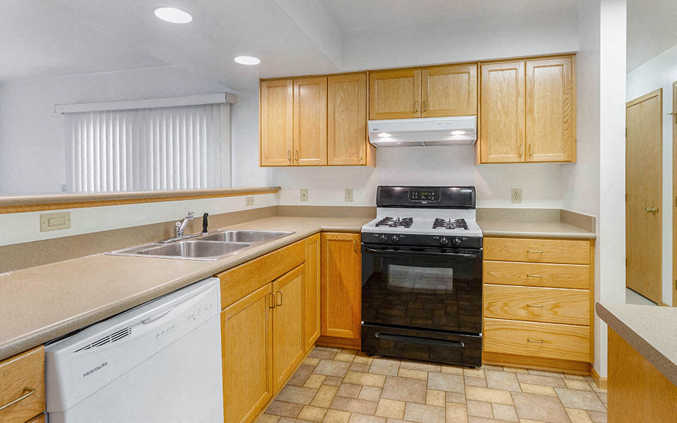 a kitchen with a stove and a sink
