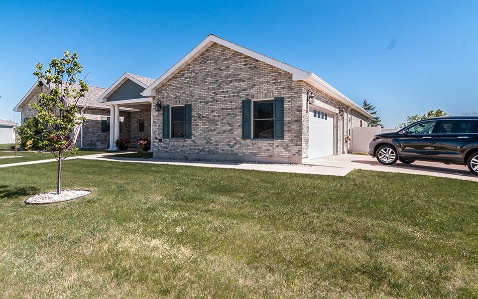 a house with a car parked in front of it