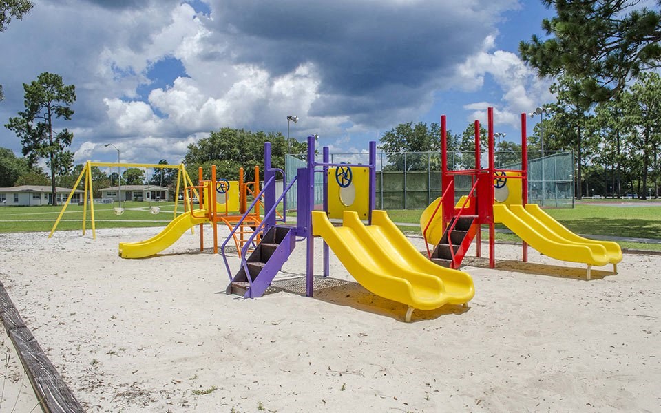 a playground with slides at a park