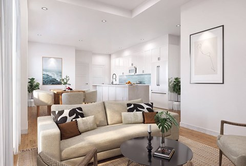 A modern living room with a large sofa and a coffee table.