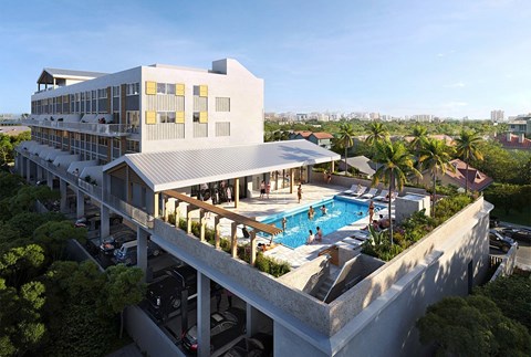 A modern building with a pool and people enjoying the sun.