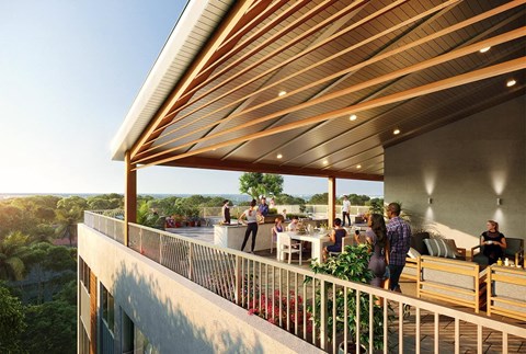 a group of people sitting on a balcony