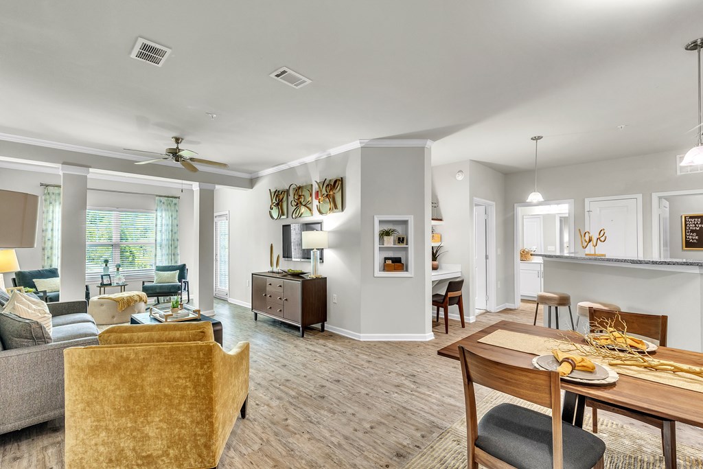 Well-lit living room with a dining area and kitchen at Sterling Creek at Richmond Hill, Richmond Hill