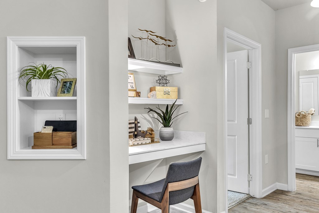 White desk with a chair and a shelf at Sterling Creek at Richmond Hill, Richmond Hill, GA, 31324