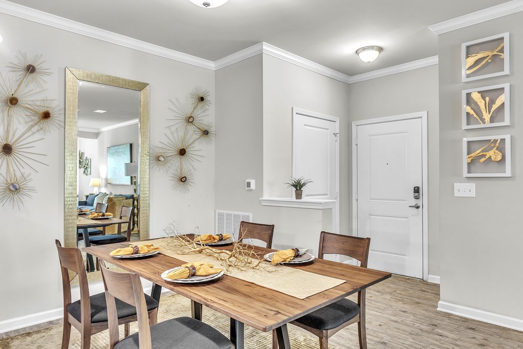 Dining room with a wooden table at Sterling Creek at Richmond Hill, Richmond Hill, GA, Georgia , 31324