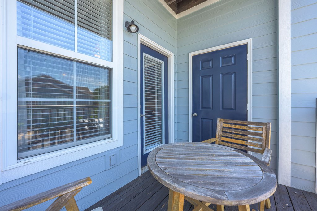 A blue door is on the right side of a white door.