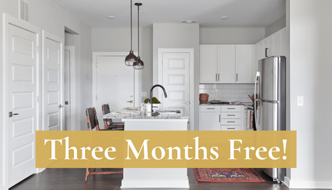A kitchen with a sign that says "Three Months Free!"