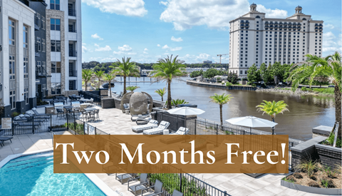 A pool area with a sign that says "Two Months Free!"