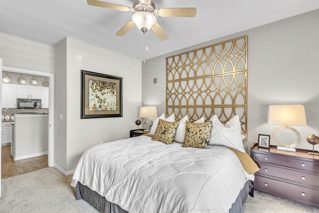 Bedroom with a large bed and a ceiling fan at Sterling Creek at Richmond Hill, Richmond Hill, GA, Georgia 