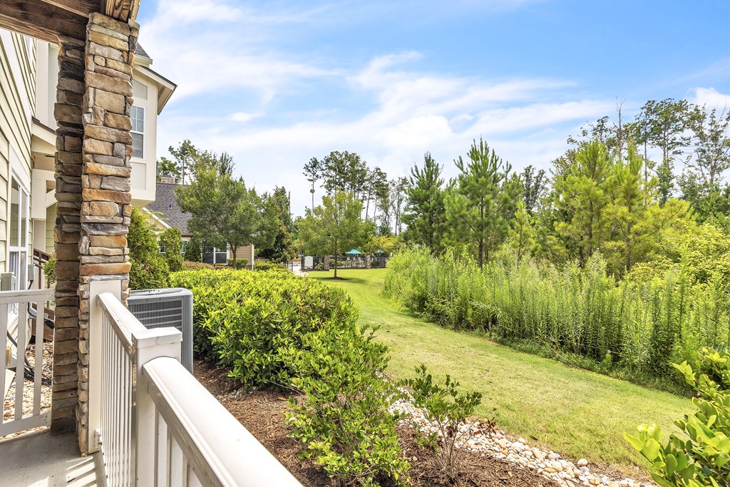 Balcony view a lush green yard at Sterling Creek at Richmond Hill, Richmond Hill, 31324