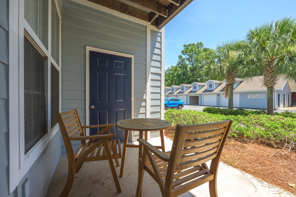 A blue door is on the left side of a house.