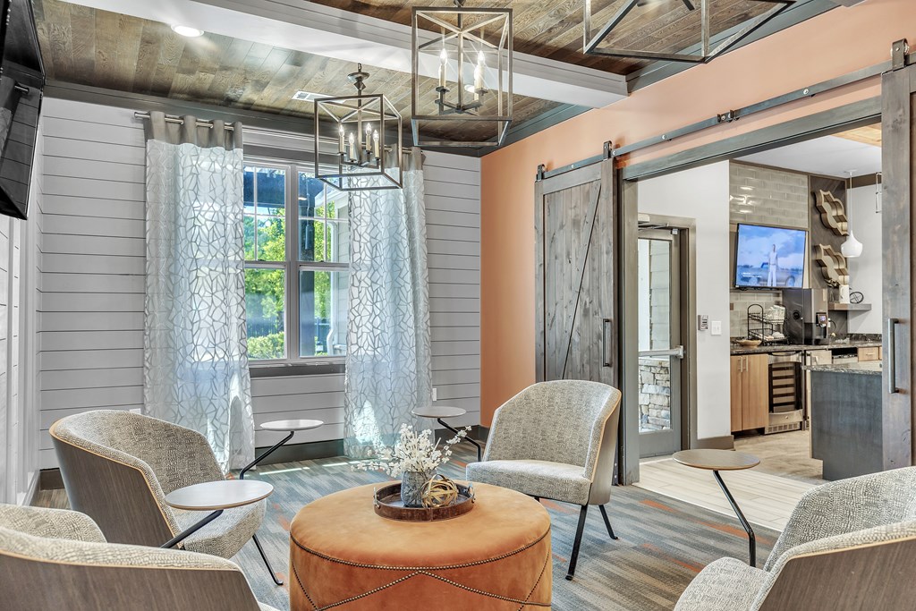Living room with a large window and a dining area at Sterling Creek at Richmond Hill, Richmond Hill, GA, 31324