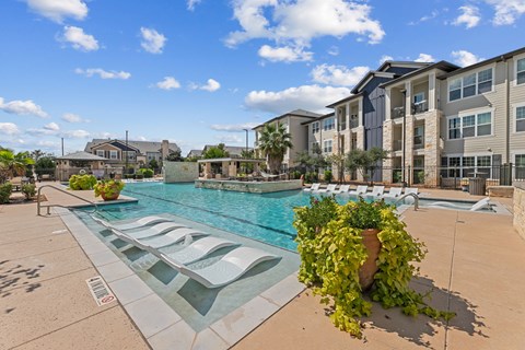 Pool Surrounded by Chairs at Citadel at Westpointe Apartments, San Antonio