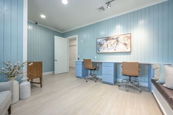 A room with blue walls and a wooden chair.