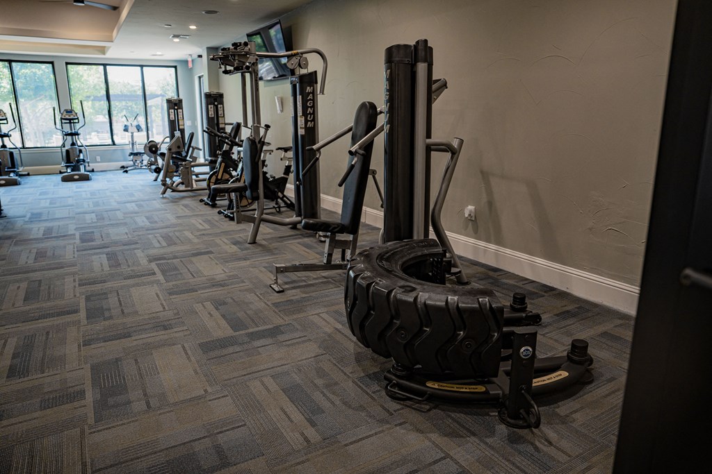 a workout room with weights and other exercise equipment at Platinum Castle Hills, Lewisville, TX