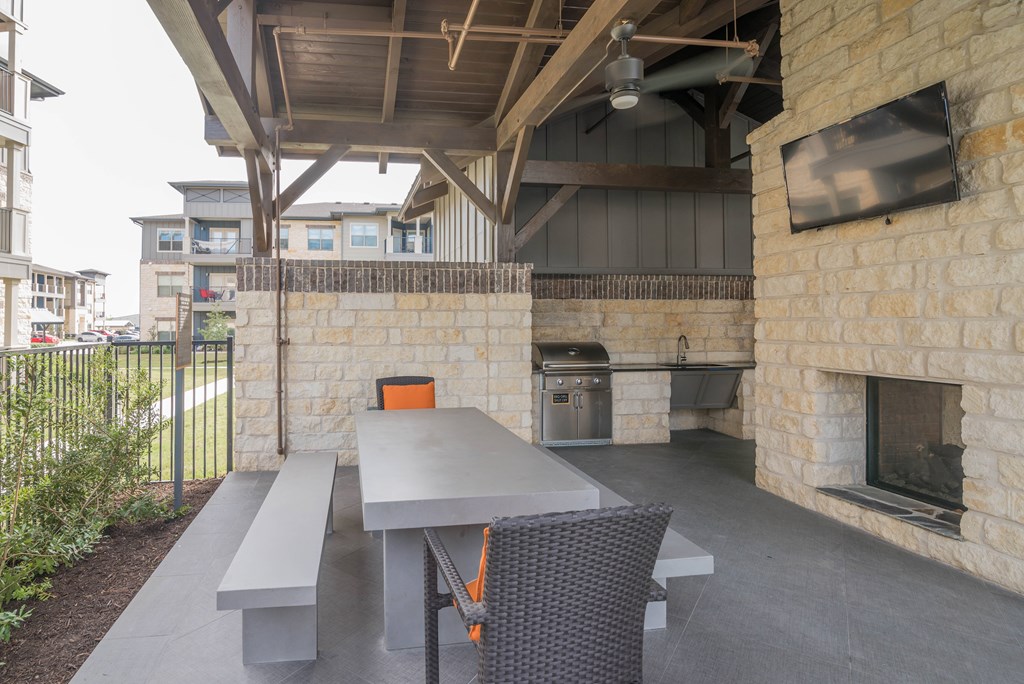 A patio with a table and chairs is shown.