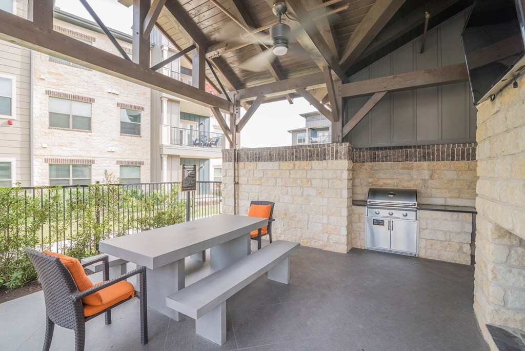 A patio with a table and chairs is shown.