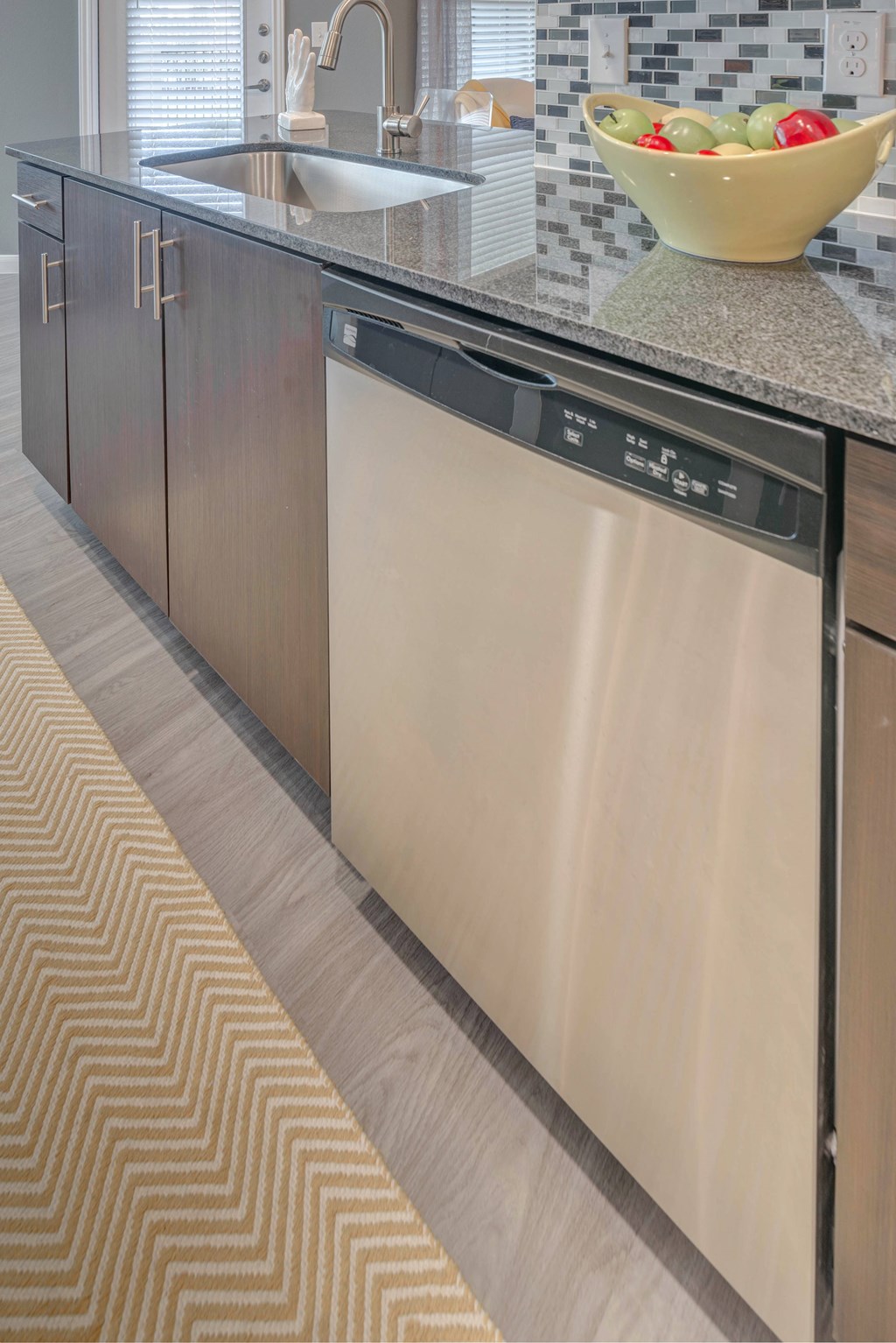 A modern kitchen with a stainless steel dishwasher.