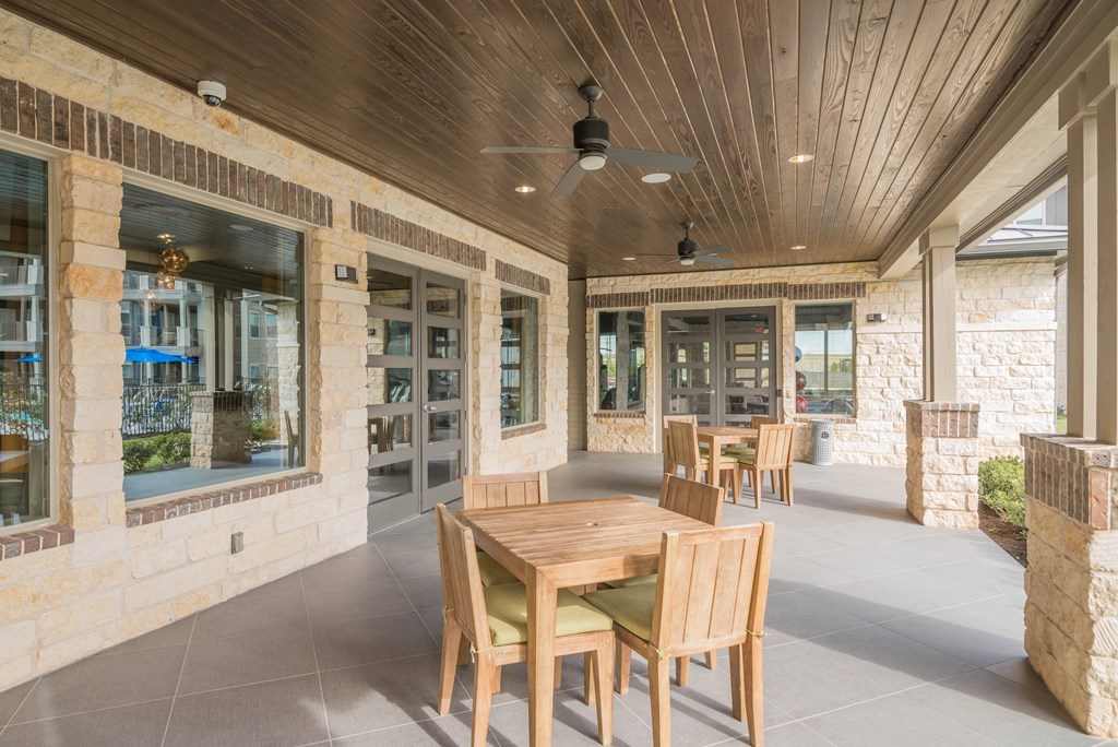 A patio with a table and chairs is shown.