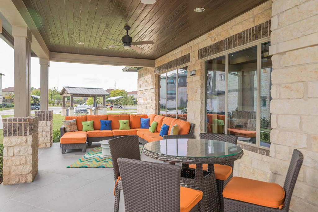 A patio with a table and chairs.