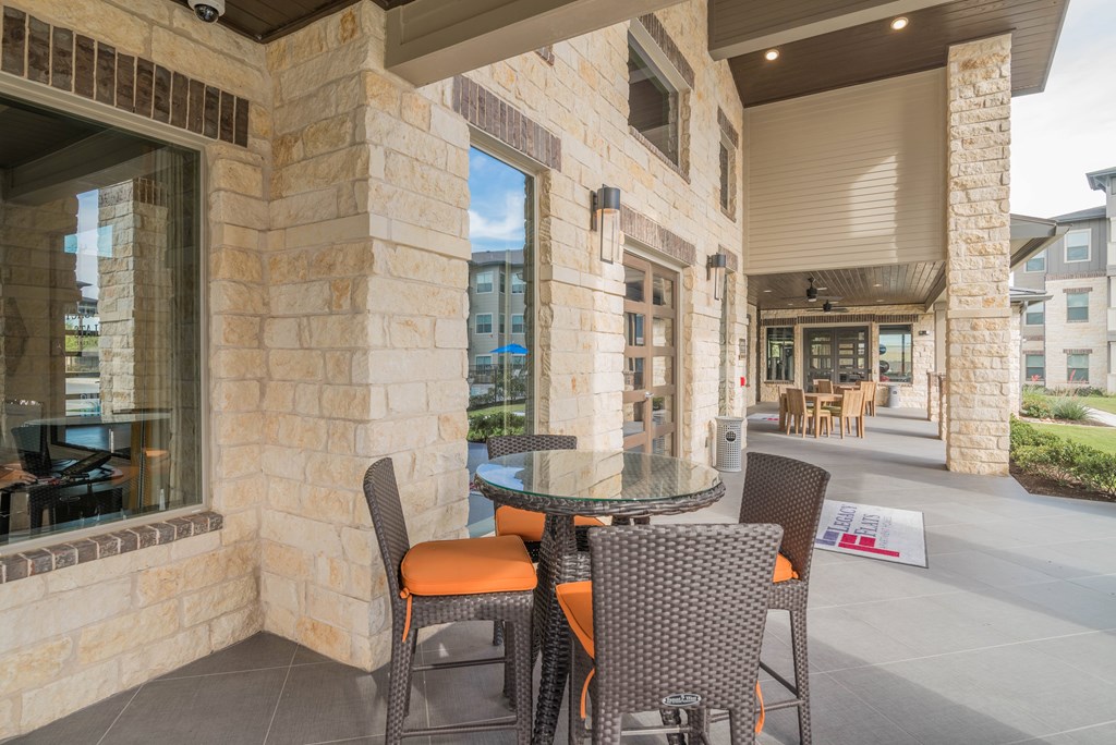 A patio with a table and chairs is shown.