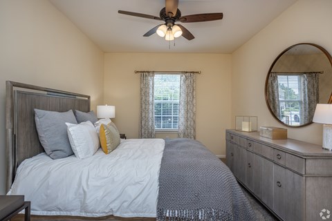 Bedroom with a Bed at Mill Creek Run Apartments, Macon, GA, 31216