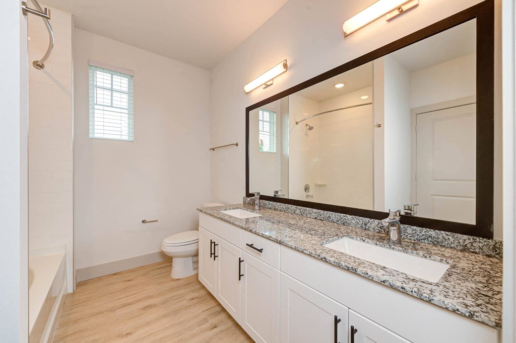 a bathroom with a sink and a mirror and a toilet at Legacy at Cibolo, Boerne, TX, 78006