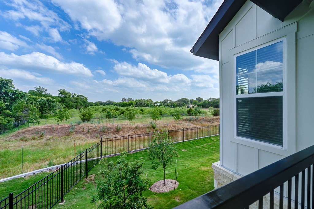 the view of the yard from the balcony of a home at Legacy at Cibolo, Boerne, TX, 78006
