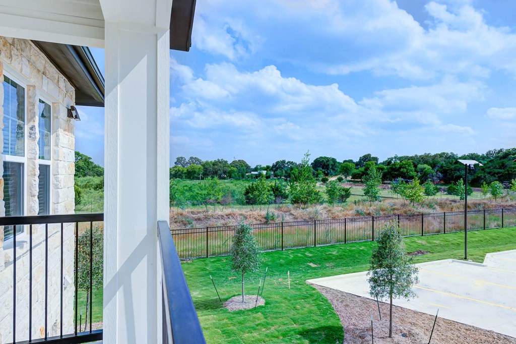 the view of the yard from the balcony of a house at Legacy at Cibolo, Boerne, 78006