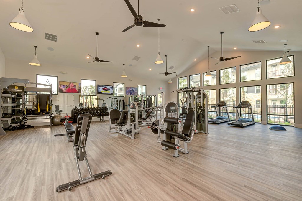 a gym with cardio machines and glass windows at Legacy at Cibolo, Boerne, 78006