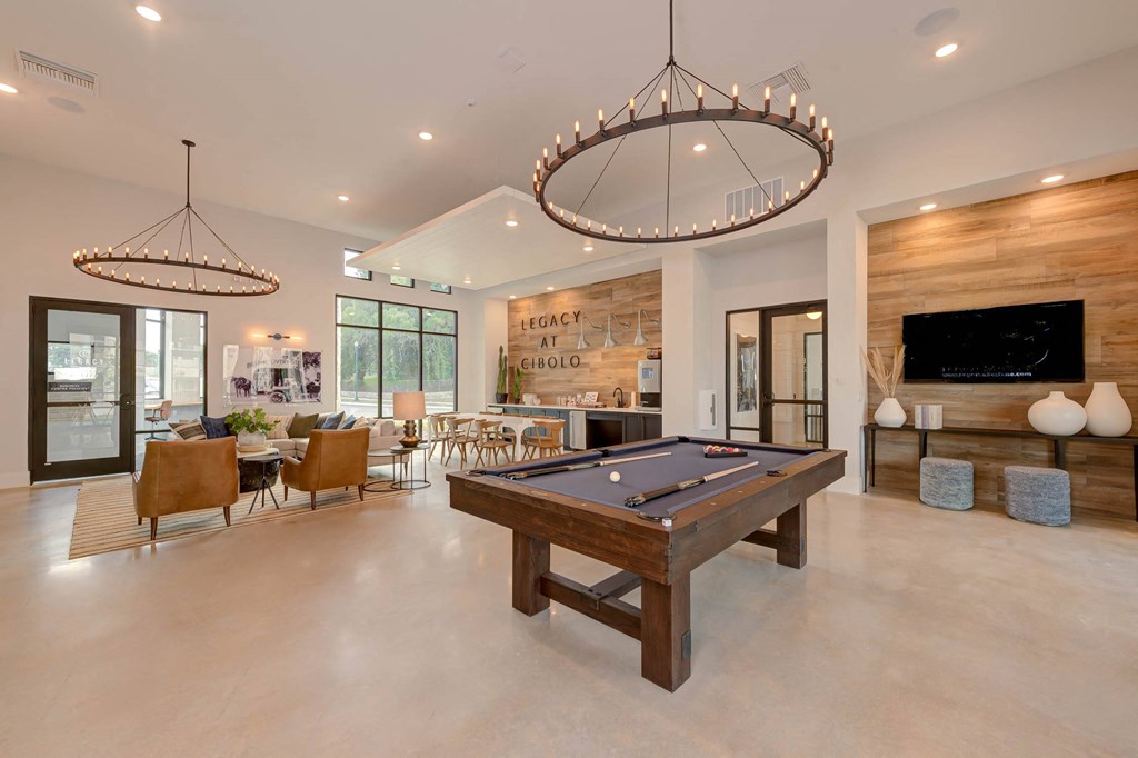 a game room with a pool table and a tv at Legacy at Cibolo, Boerne, TX, 78006