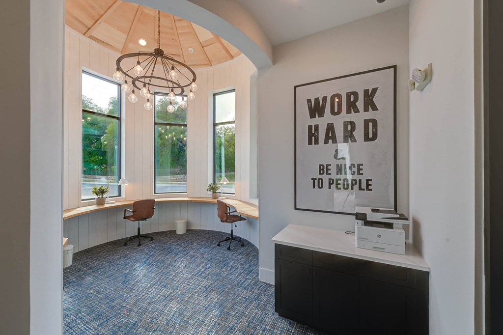 a home office with a poster on the wall and a desk at Legacy at Cibolo, Boerne, TX, 78006