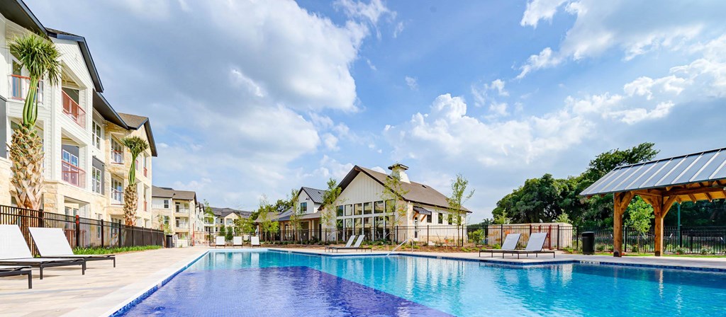 a large swimming pool in front of a group of houses at Legacy at Cibolo, Boerne