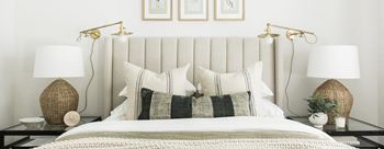 a bedroom with a bed and pillows and two lamps at Legacy at Cibolo, Boerne