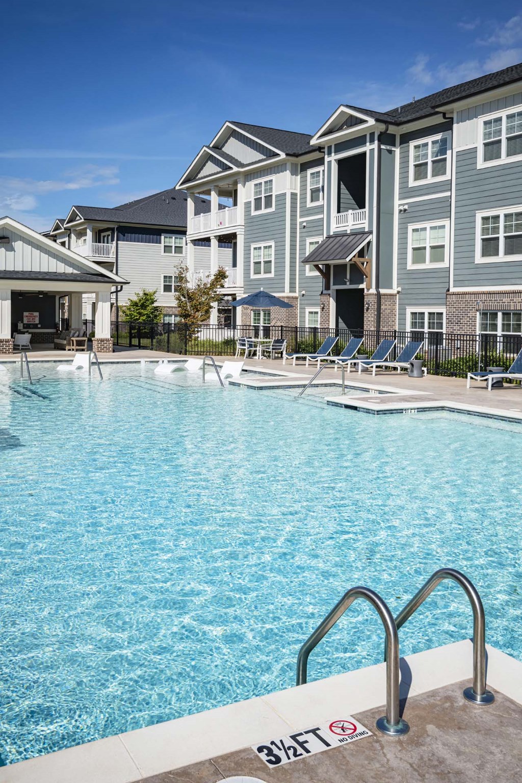 A swimming pool with a 3 feet depth sign at Waterleaf at Neely Ferry Apartments, South Carolina 29680