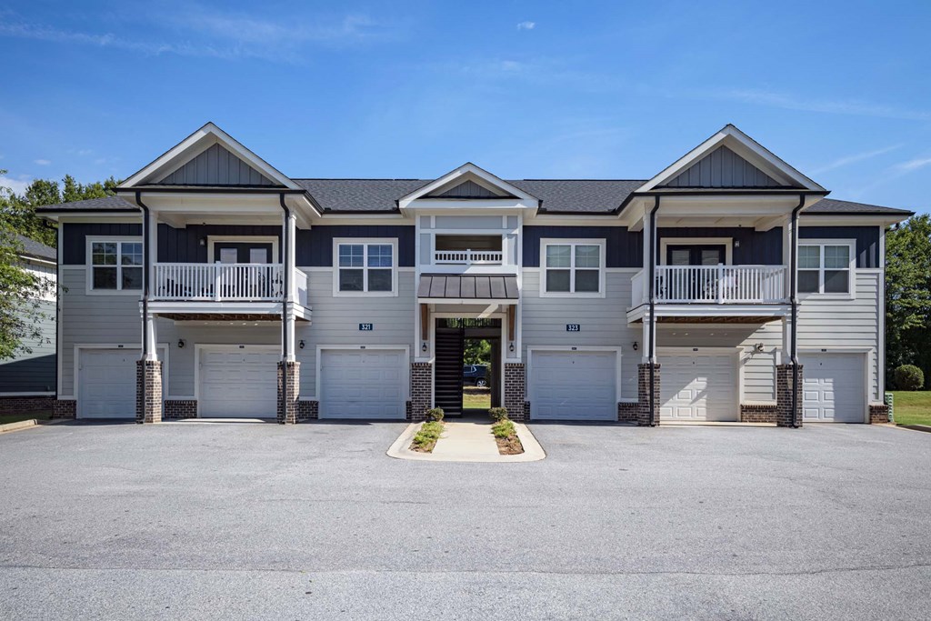 A row of houses with garages and driveways at Waterleaf at Neely Ferry Apartments, Simpsonville, 29680
