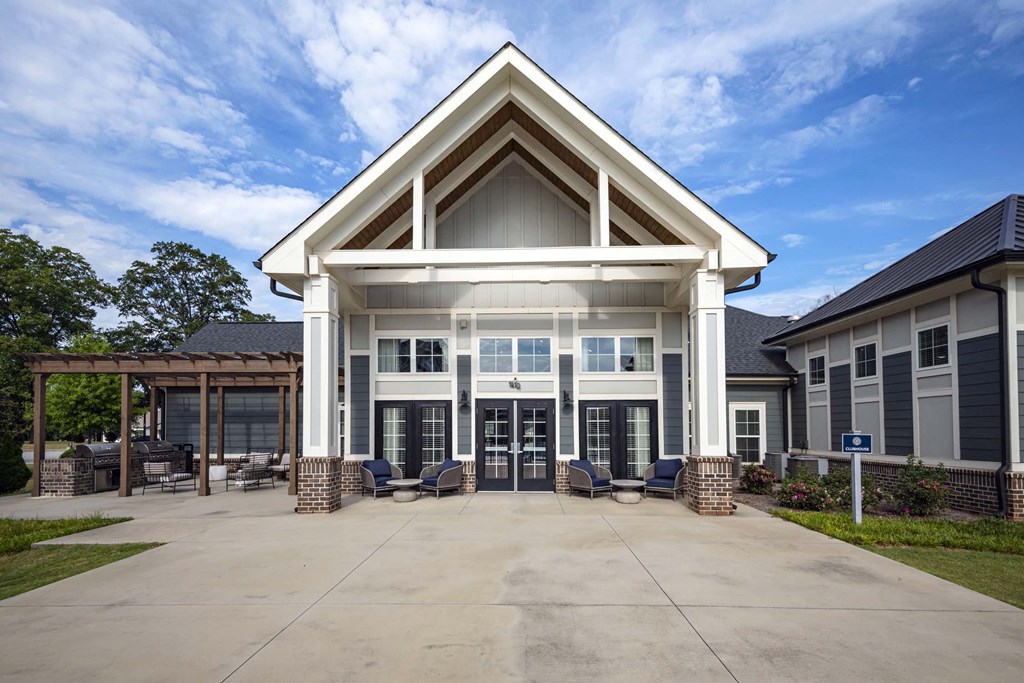 A large building with a white and brown roof and a covered patio area at Waterleaf at Neely Ferry Apartments, Simpsonville
