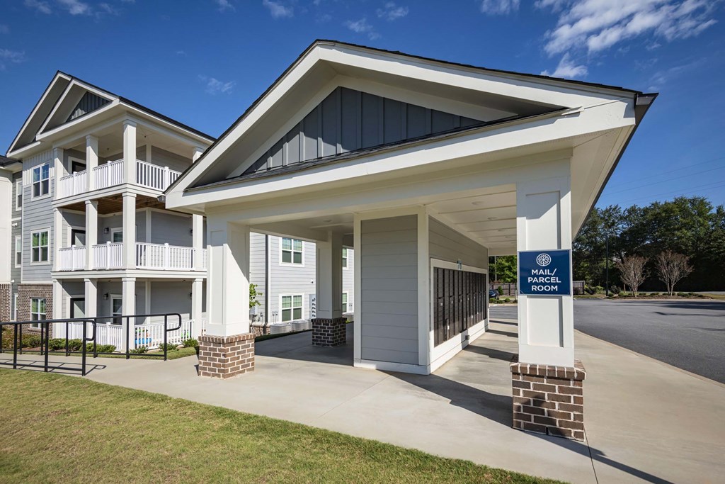 The image shows a building with a sign that reads at Waterleaf at Neely Ferry Apartments, Simpsonville, SC 29680
