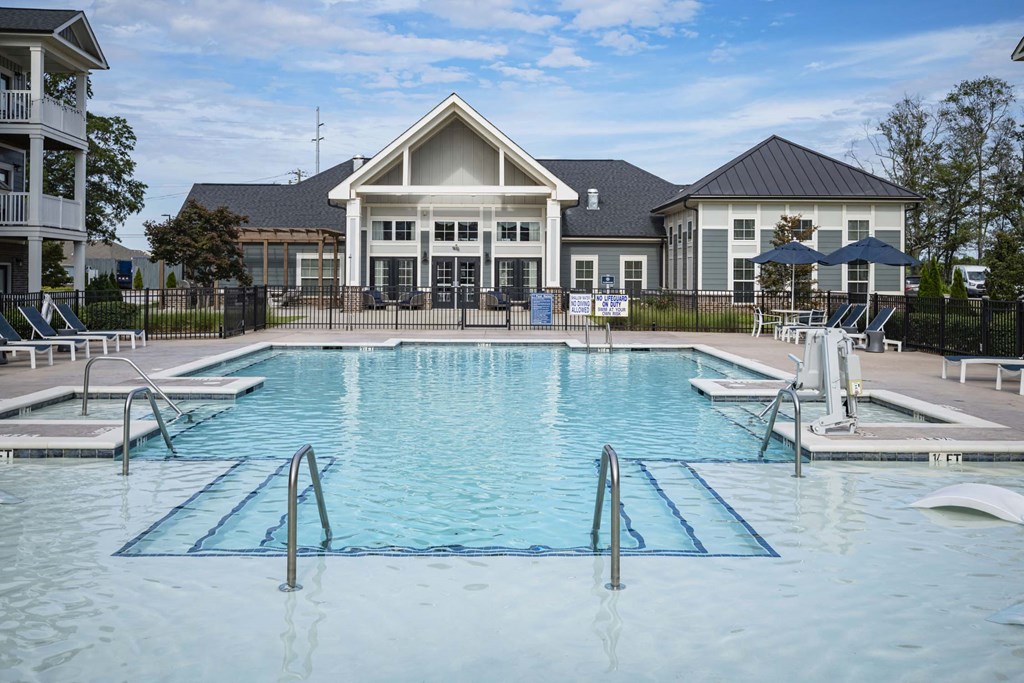 A large swimming pool in front of a building at Waterleaf at Neely Ferry Apartments, Simpsonville