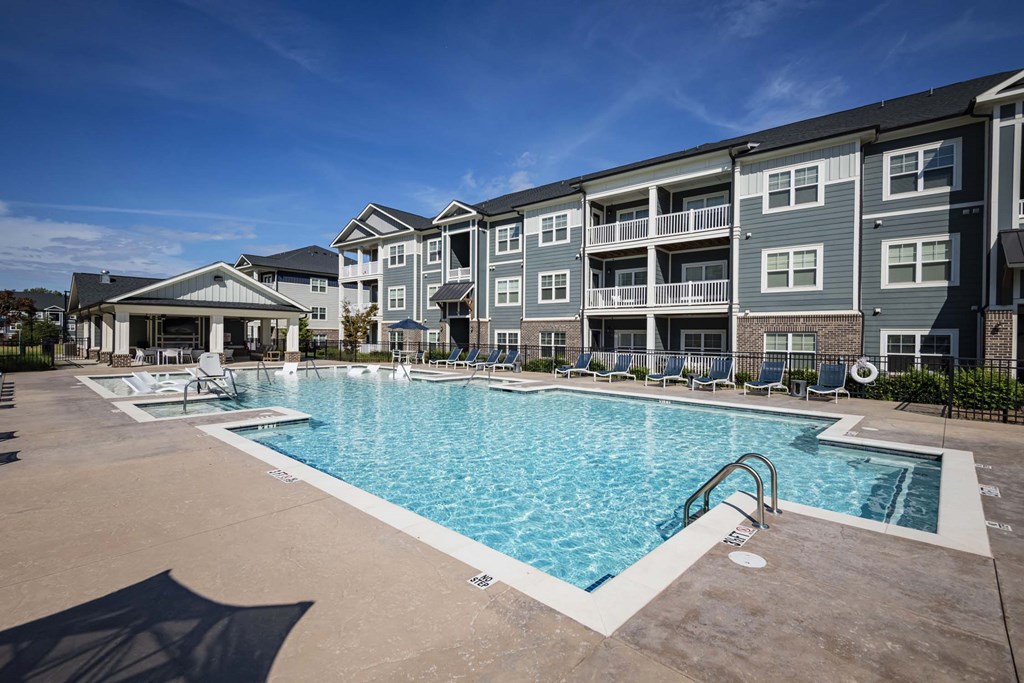 A large swimming pool in front of apartment buildings at Waterleaf at Neely Ferry Apartments, Simpsonville, SC