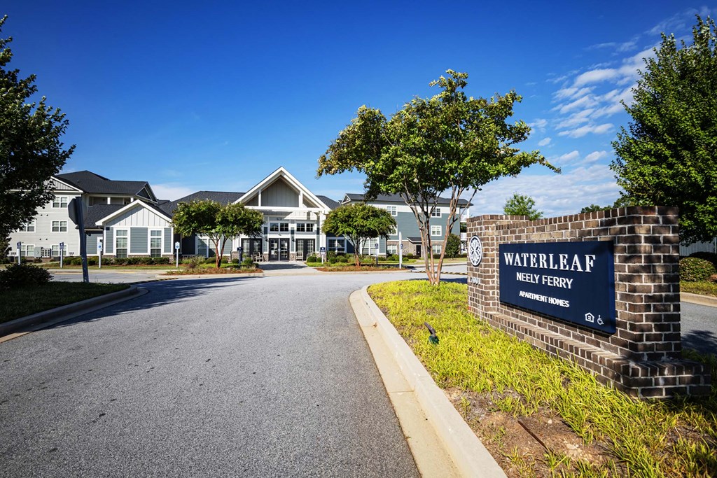 A sign for Waterleaf Homes stands in front of a row of houses at Waterleaf at Neely Ferry Apartments, Simpsonville, SC