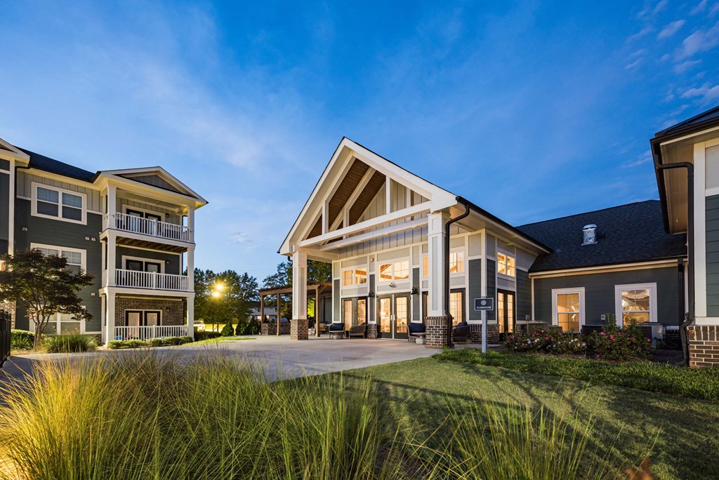 A modern house with a spacious front yard at Waterleaf at Neely Ferry Apartments, Simpsonville
