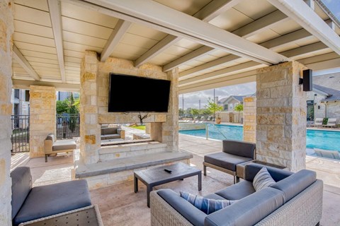 a living room with a fireplace and a television