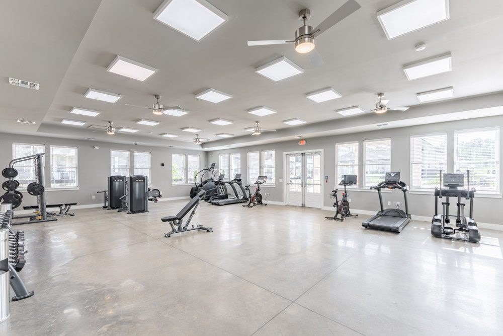 Spacious gym with various exercise equipment at Prosper Madison Oaks, Madison, AL