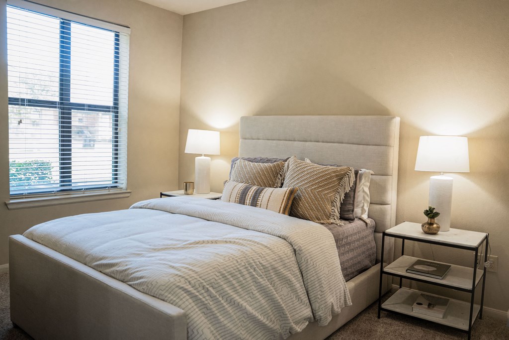 a bedroom with a large bed and a window at Platinum Castle Hills, Lewisville, 75056