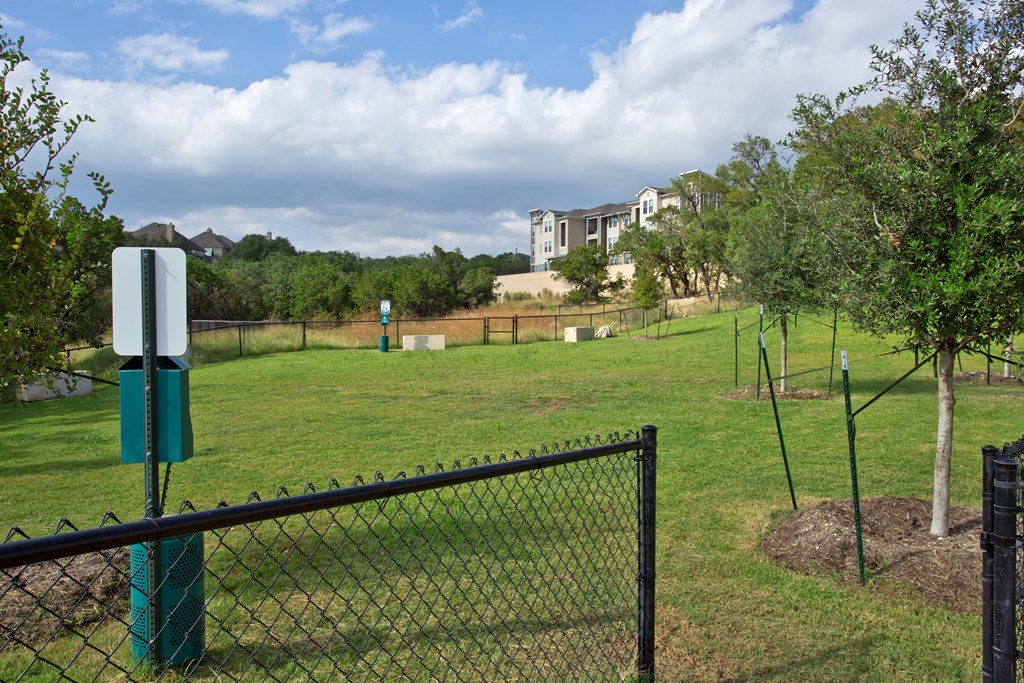 Pet Play Area with a black fence at Edge and Stone, San Antonio