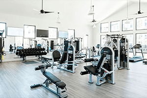 a gym filled with cardio machines and other gym equipment at Legacy at Cibolo, Boerne, TX