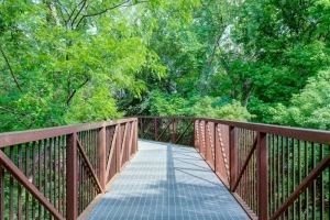 a wooden bridge with trees in the background at Legacy at Cibolo, Boerne, TX, 78006