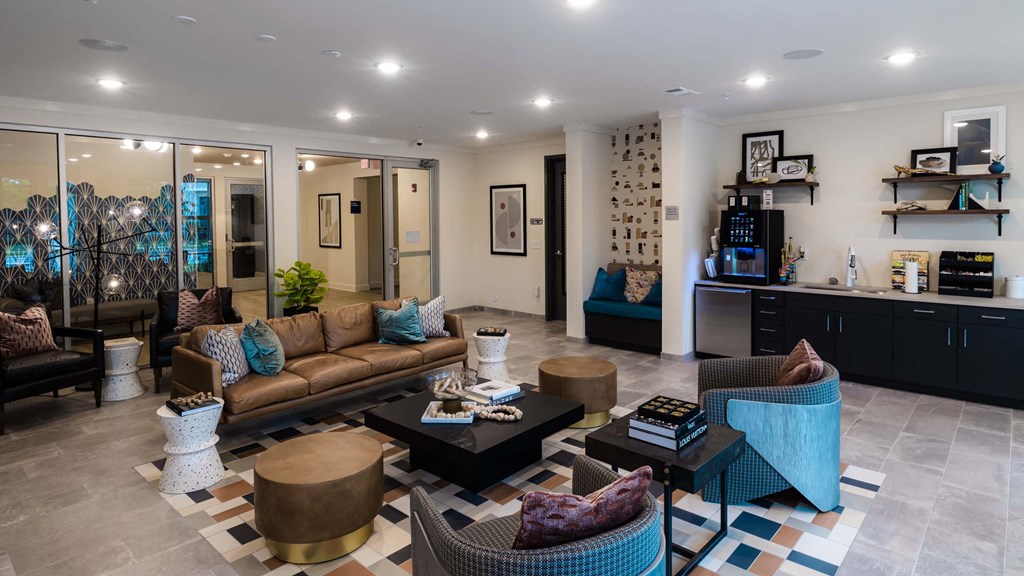 A living room with a brown couch, a coffee table at Hudson at Renaissance Apartments, Wilmington